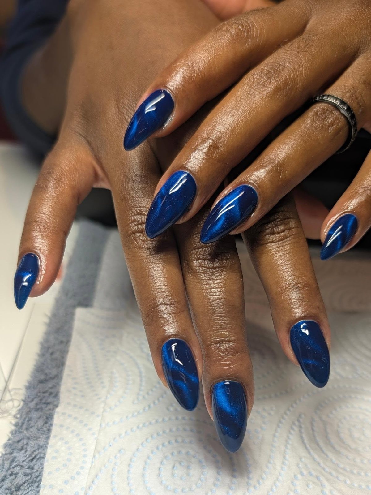 Sapphire cat-eye almond nails by Rue Nails